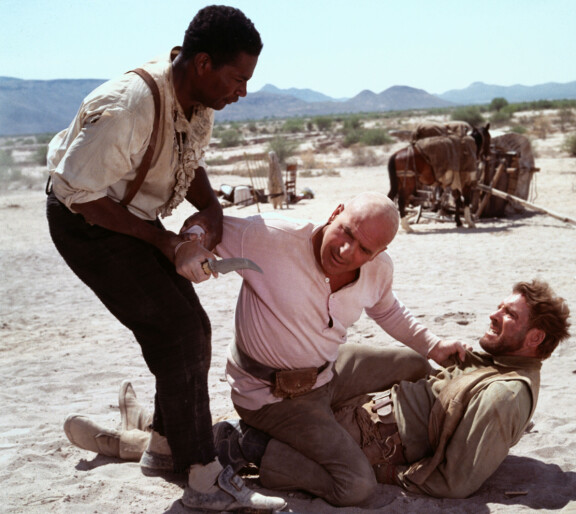 Ossie Davis, Telly Savalas ja Burt Lancaster tähdittävät lännenkomediaa Päänahanmetsästäjät.