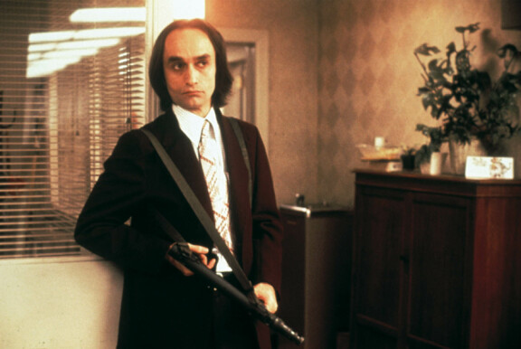 Johnin lyhyeksi jääneen uran merkittävin rooli oli Fredo Corleone Kummisetä I- ja Kummisetä II -elokuvissa. Kuva on elokuvasta Hikinen iltapäivä.