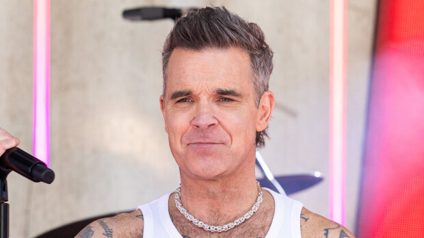 Robbie Williams riiteli rokkarinaapurin kanssa – näin kiista päättyi