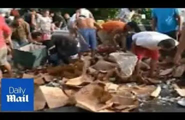 Konjakkikuorma kaatui Filippiineillä - paikalliset hamstrasivat kilpaa ilmaista viinaa! Katso video!