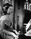 Kuherruskuukausikesänä 1948 Aino kuvasi Ilmari Unhon ohjaaman elokuvan Ruusu ja kulkuri.